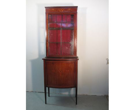 EDWARDIAN INLAID MAHOGANY SINGLE DISPLAY CABINET OVER CUPBOARD, having moulded satinwood foliate inlaid frieze, single glazed