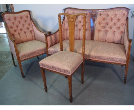 EDWARDIAN INLAID MAHOGANY SEVEN PIECE PARLOUR SUITE comprising two seater sofa with buttoned panels to the back and stuff-ove