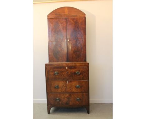 EARLY 19TH CENTURY MAHOGANY SECRETAIRE BOOKCASE having arched pediment over a pair of oval blind panel doors revealing adjust