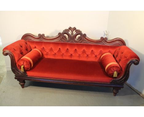 VICTORIAN MAHOGANY SHOW FRAME DOUBLE ENDED SOFA having foliate pierced cresting, buttoned scroll over arms on turned baluster