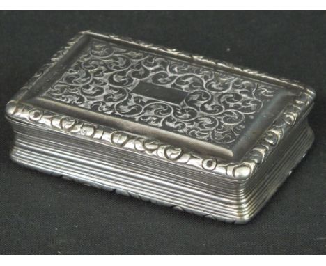 GEORGE IV SILVER RECTANGULAR SNUFF BOX engraved with scroll designs with reeded border and central small cartouche. Birmingha