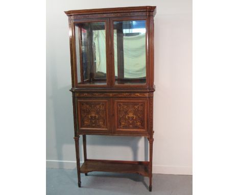 A LATE VICTORIAN INLAID ROSEWOOD TWO STAGE DISPLAY CABINET BY EDWARD & ROBERTS the glazed cabinet top having moulded and cros