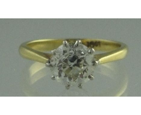 AN 18CT GOLD AND DIAMOND SOLITAIRE RING. The old cut diamond an estimated 1.5cts. Ring size K.  CONDITION REPORT: In good con