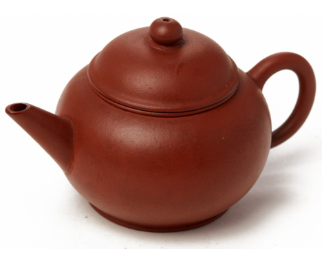 A SMALL SPHERICAL YIXING POTTERY TEAPOT Impressed seal mark to base 11cm / 80g
Condition: One small chip to the inside of the