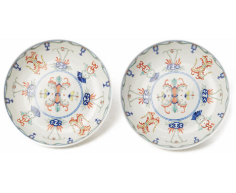 A PAIR OF DOUCAI PORCELAIN SAUCER DISHES Hongxian iron red four character marks within a double square to base 18cm diameter,