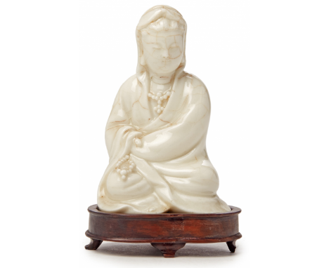 A SMALL 'BLANC DE CHINE' PORCELAIN GUANYIN Probably early Qing Dynasty, according to the inventory Indistinct impressed doubl