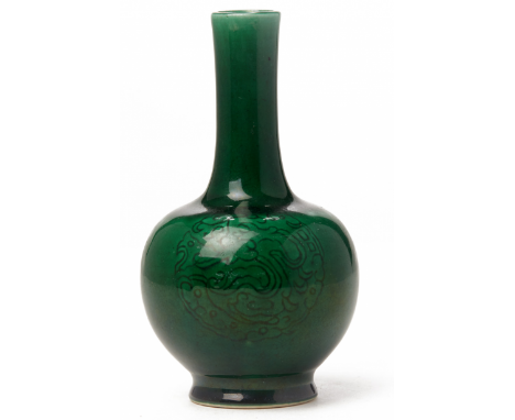 A SMALL GREEN GLAZED PORCELAIN BOTTLE VASE With monochrome green glaze, incised decoration 12cm high 130gr Provenance: purcha