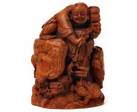 A BAMBOO CARVING OF A BOY WITH A THREE LEGGED TOAD Late 18th / 19th Century Finely carved with the smiling figure holding coi