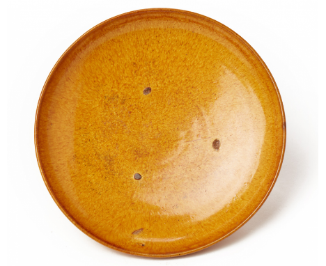 AN AMBER GLAZED SHALLOW DISH Liao dynasty (10th to 11th Century), according to the collector's inventory The interior with th