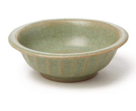 A SMALL LONGQUAN CELADON CIRCULAR DISH Probably Song Dynasty, according to the inventory Decorated with lotus petals on the e