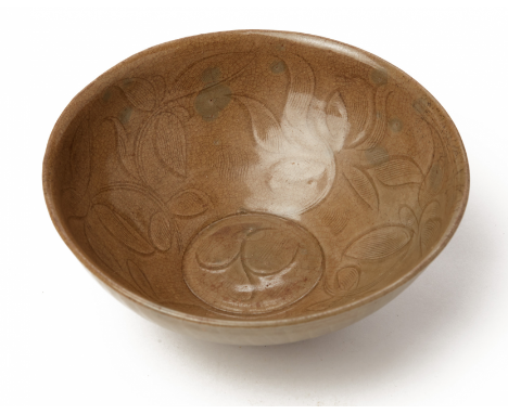 AN INCISED CELADON BOWL Chinese or Korean Incised with stylised lotus flower to the inside and moulded with lotus petal to th