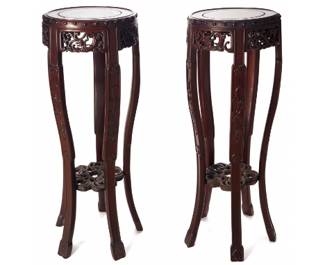 A PAIR OF CIRCULAR BLACKWOOD STANDS With a beautiful carved apron, and curved legs 35cm diameter x 90cm high &gt;&gt; Overall