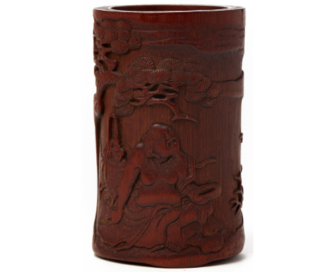 A CARVED BAMBOO BRUSH POT (1) Likely 19th or early 20th Century, according to the inventory Carved with a sage seated beneath