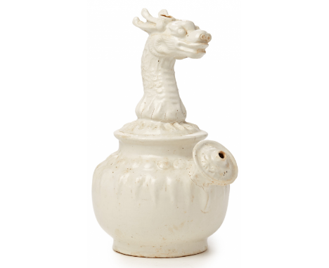 A WHITE GLAZED DRAGON 'KENDI' Late Ming or Early Qing Dynasty, according to the inventory 27cm high 1kg Provenance: Purchased