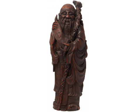 A LARGE BAMBOO ROOT CARVING OF SHOU LAO Qing Dynasty, 19th Century, according to the inventory Represented holding an open sc