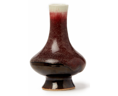 A SMALL FLAMBÉ GLAZED BOTTLE VASE 19th century, according to the inventory 12cm high / 280g Provenance: Purchased from Moon G