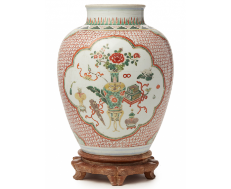 A 'FAMILLE VERTE' PORCELAIN OVOID JAR Kangxi, according to the inventory Decorated with two shaped oval reserves, one featuri