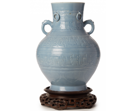 A 'CLAIR DE LUNE' GLAZED HU FORM VASE The neck featuring greek key borders and fixed drop rings, above twin qilin head loop h