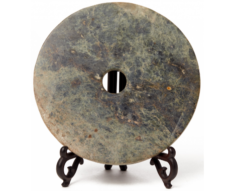 A JADE CEREMONIAL BI DISC Liangzhu Culture (c.3300-2200 BC) style Of mottled light and dark tones with white veining, and wit