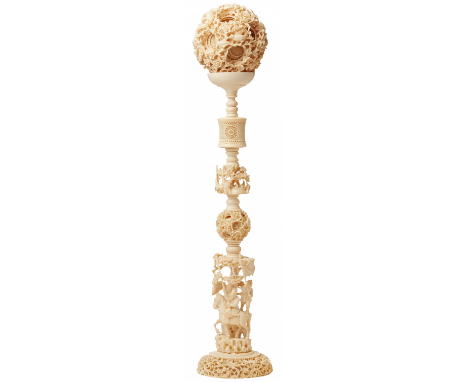 A LARGE CHINESE CARVED IVORY 'PUZZLE BALL' ON STAND Canton, circa 1900 Of typical form, the ball formed of at least seven lay