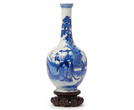 A BLUE AND WHITE PORCELAIN BOTTLE VASE Likely 20th Century Decorated with figures in a garden setting, on wood stand 26cm hig