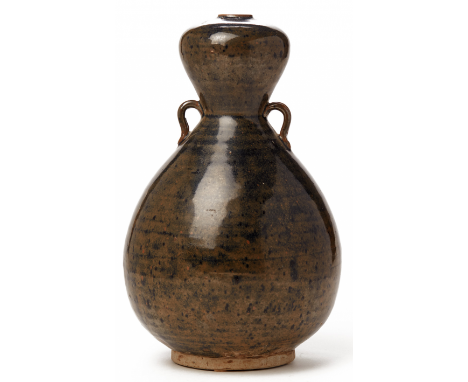 A MOTTLED BLACK GLAZED DOUBLE GOURD VASE 10th-11th Century, according to the inventory 27cm high 1.6kg Provenance: Purchased 