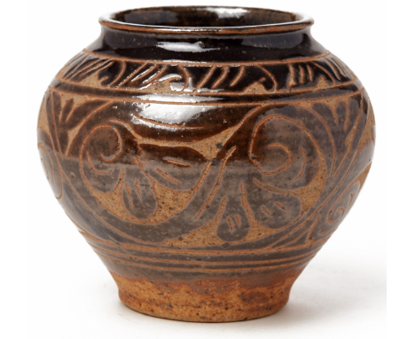 A CIZHOU CARVED OVOID JAR Song or Jin Dyntasy, 11th to 12th Century, according to the inventory With stylised foliate decorat