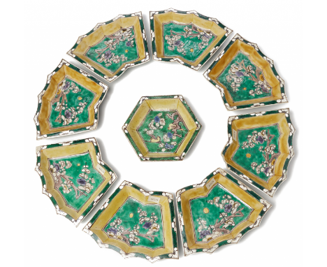 A 'FAMILLE VERTE' BISCUIT SWEETMEAT SET Comprising eight fan shaped dishes and one central hexagonal dish, decorated with pru