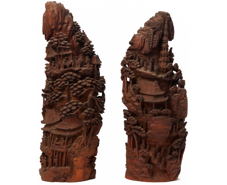 A PAIR OF LARGE BAMBOO ROOT MOUNTAIN LANDSCAPE CARVINGS Each carved and a continuous scene of figures amongst pagodas and ter