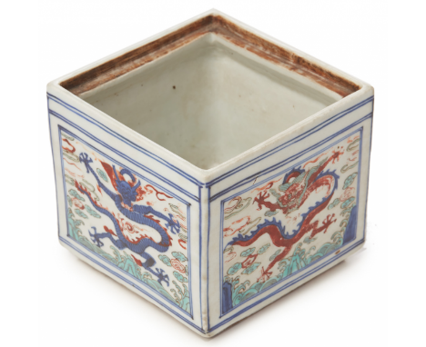 A SQUARE WUCAI PORCELAIN DRAGON BOX Of Wanli style Decorated to each side with a five clawed dragon amongst clouds, cover lac