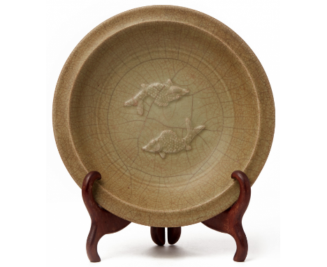 A FINE 'GOLDEN' CELADON TWIN FISH DISH Song Dynasty, according to the collector's inventory The centre relief decorated with 