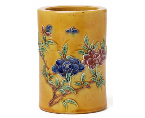 A SANCAI STYLE BRUSH POT Probably 19th century, according to the inventory Decorated with flowers in relief on a yellow groun