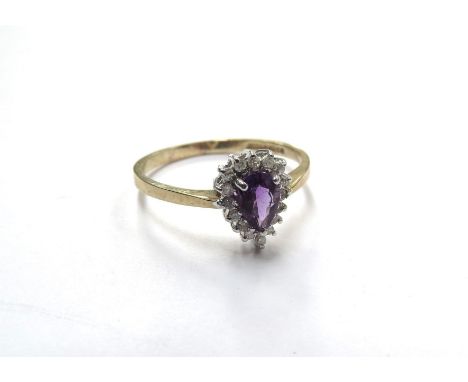 A 9ct gold diamond chip and pear shaped amethyst ring. Size P, 1.7g 