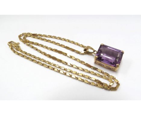 An amethyst pendant hung on a gold chain marked 98%, 44cm long, 10g (15.9g with pendant) 