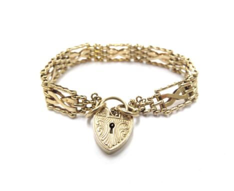 A 9ct gold gate link bracelet with scroll design padlock clasp, 18cm long, 18.4g 