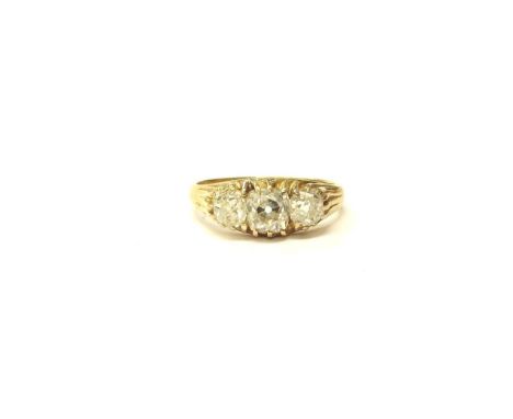 A three stone diamond ring in 18ct gold, 1.50ct total approx of old cut diamonds. Size N, 3.2g. With copy of Windsor Bishop v