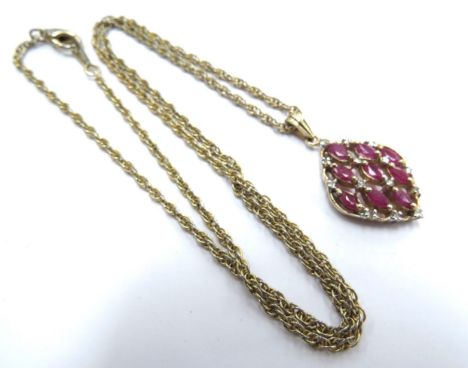 A 9ct gold diamond and ruby cluster pendant, 2.5g hung on metal chain 