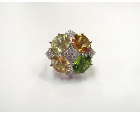 A green, yellow and orange quartz, peridot and diamond cluster ring, 0.50ct diamond total approx, stamped 18k, 2.5cm wide. Si