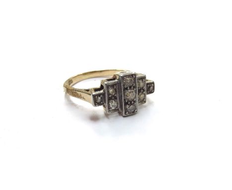 An 18ct gold and platinum set diamond ring of Art Deco style, stepped rows of diamonds. Size P, 4.6g 