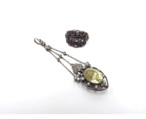 A Georgian style enamel and paste set ring, size J and a paste set drop pendant set with a pale yellow facet cut stone, 7cm d