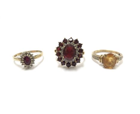 Three 9ct gold rings, including ruby and diamond cluster, size O, citrine and diamond chip, size O and garnet and diamond chi