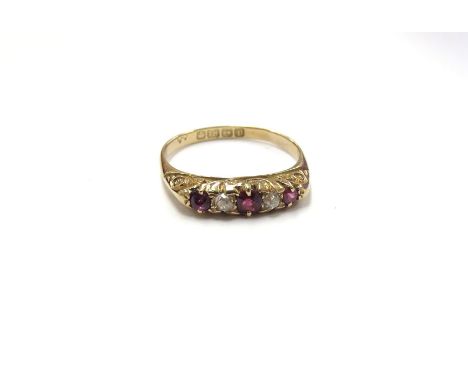 An 18ct gold five stone ruby and diamond ring, Birmingham 1916. Size P, 3.2g 