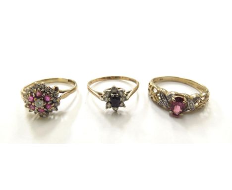 Three 9ct gold rings including ruby and diamond cluster, size K/L, sapphire and zirconia cluster, size M/N, and pink stone wi