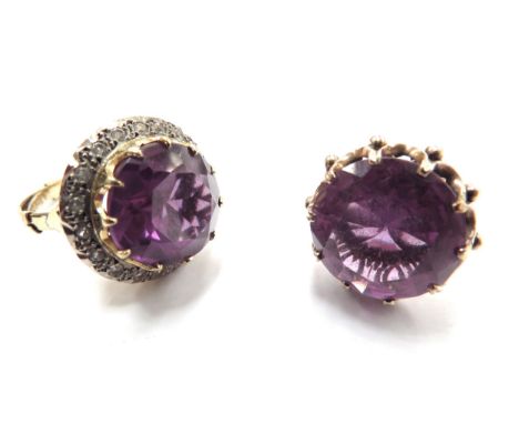 Two unmarked gold dress rings, both with a large amethyst coloured stone one framed by clear stones, sizes R and S, 16.5g tot