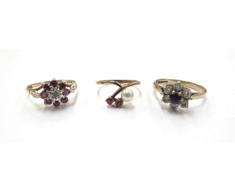 Three 9ct gold rings including pearl and ruby, size G, 1g, ruby and diamond cluster, size J, 1.6g and sapphire and paste, siz