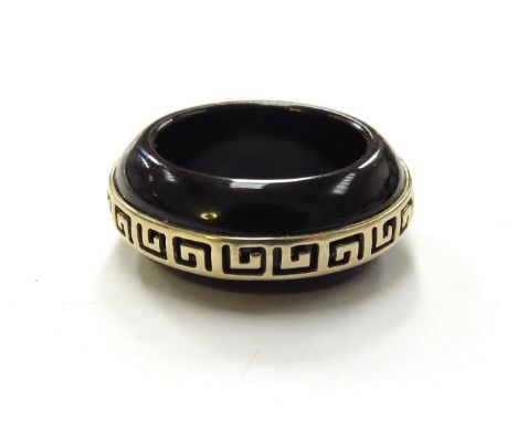 A black onyx ring with a Greek key design outer band, stamped 14k China. Size P/Q, 6.9g 