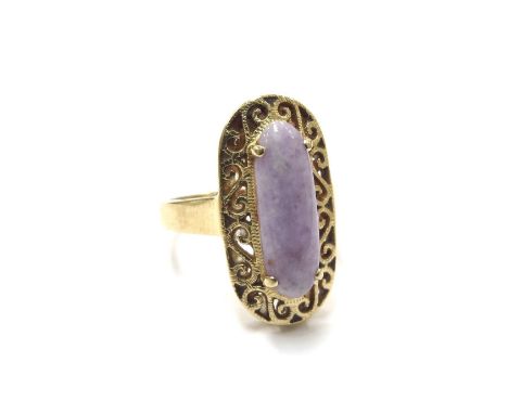 A purple jade dress ring, stamped 18ct. Size N, 5.6g 