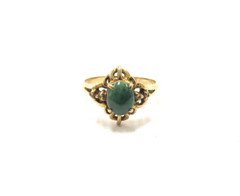 A gold ring with green jade cabochon, stamped 18k. Size K, 2g 