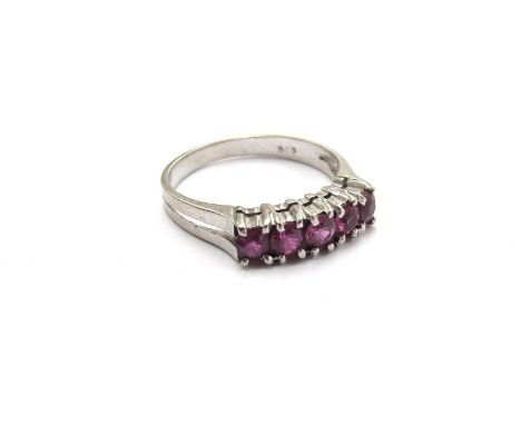 A white gold five stone ruby ring, stamped 585. Size N, 2.5g 