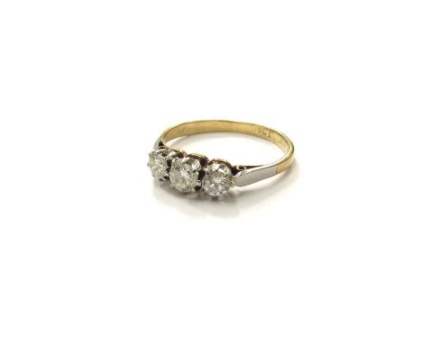 A three stone diamond ring, 0.48ct approx total, stamped 18ct. Size N, 2.2g 